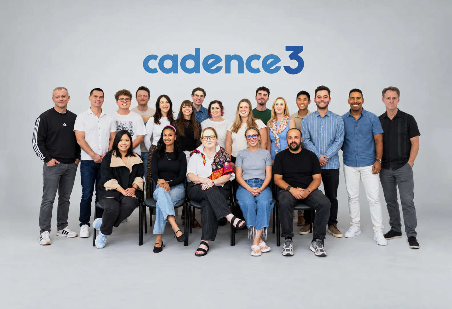 The Cadence 3 team photographed together in studio beneath the agency wordmark.