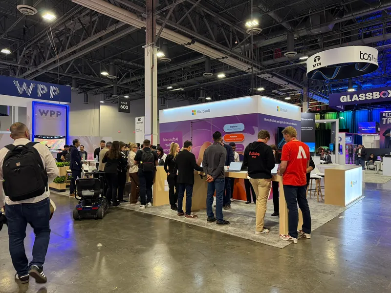 The show floor from the stand, partner pavilions stretching into the hall.