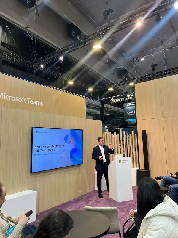 A product marketing lead opening a session on next-level event experiences in the Teams theatre.