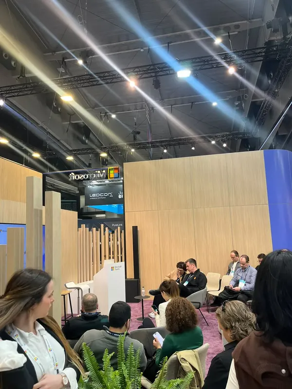 A panel conversation underway in the stand lounge, guests seated across the carpet.